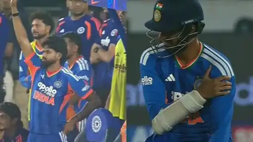 IND vs WI 4th T20I: a player in the dugout raising his arm to signal, and a batter in a “SHREY” helmet holding his shoulder with a bandaged forearm