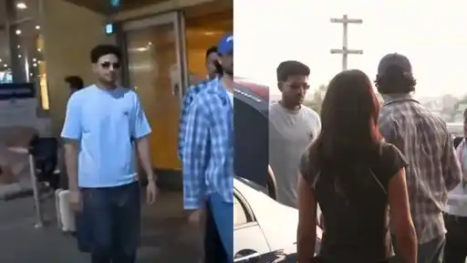 young man in sunglasses and a light-blue t-shirt walking out of a building beside a man in a blue check shirt, then standing beside a car with a woman and a man in a cap