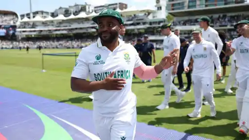 South Africa players in white Test kit and green caps smile and walk across the outfield in ICC WTC Final 2025 shirts, as South Africa confirm their playing XI for the 1st Test vs Australia in Durban