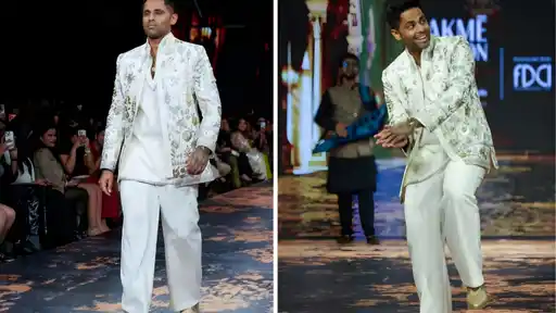 Suryakumar Yadav striking his batting pose on the Lakmé Fashion Week runway for Ethnix by Raymond